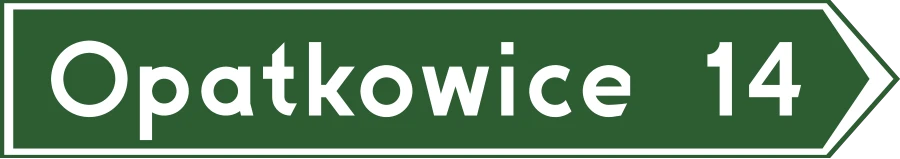 Drogowskaz w kształcie strzały z odległością do miejscowości